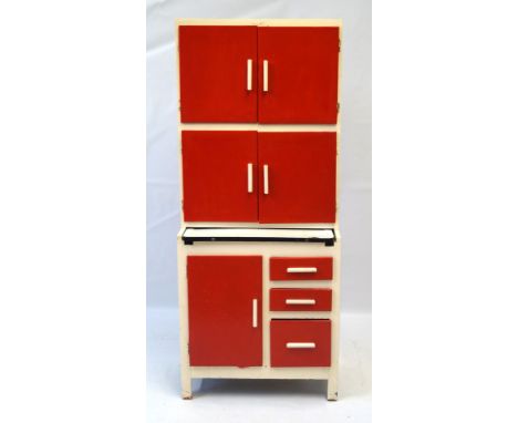 A postwar kitchenette with red painted doorsCirca 1950s having enamel work top, height 183cm, length 77cm    CONDITION REPORT
