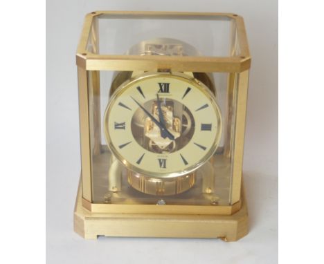 A Jaeger Lecoultre 'Atmos' clockWith brass frame, the circular dial with Roman numerals, height 24cm, complete with original 
