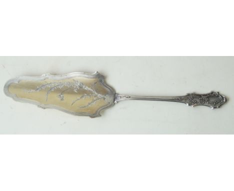 A continental white and gilt metal cake sliceHaving cast and incised floral decoration, fitted in original box marked A LA Ge