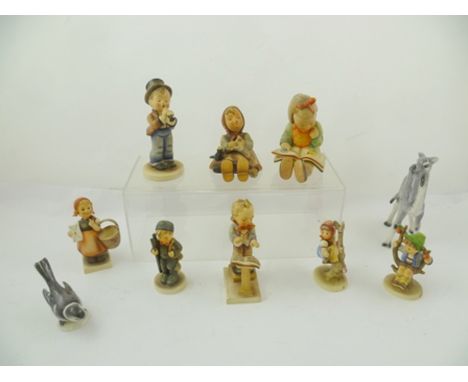 A COLLECTION OF GOEBEL CERAMIC CHILD FIGURINES including Band Leader, 13cm high and a Goebel young Camel (9) 