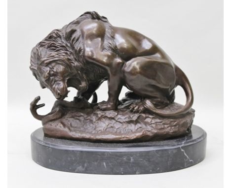 A 20TH CENTURY CAST PATINATED BRONZE LION ATTACKING A SERPENT, on ground work base, raised on a polished marble plinth, overa