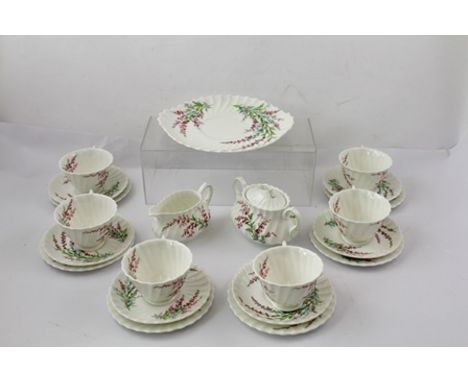 A ROYAL DOULTON PART TEA SERVICE, 'Bell Heather' pattern comprising; six cups, saucers and tea plates, serving dish, milk jug