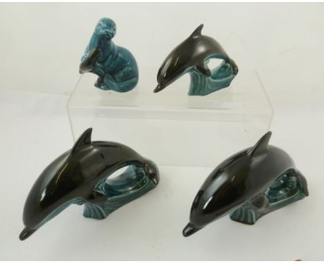 A SELECTION OF THREE 1960's POOLE EARTHENWARE DOLPHINS & SEAL in blue and black colouring 