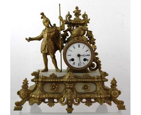 A LATE 19TH CENUTRY CONTINENTAL MANTEL CLOCK, having gilded cast spelter case mounted with a knight in armour, with white ena