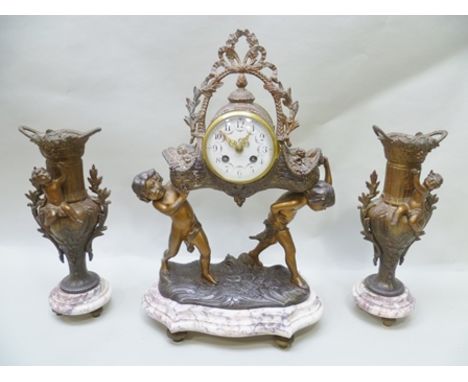 A FRENCH CLOCK GARNITURE in bronzed spelter and polished marble, the clock modelled as two cherubs supporting a basket of flo