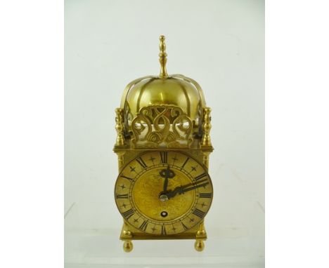 SMITHS ENGLISH CLOCKS LTD. A BRASS LANTERN DESIGN TABLE CLOCK, having chapter ring with Roman numerals, 24.5cm high 