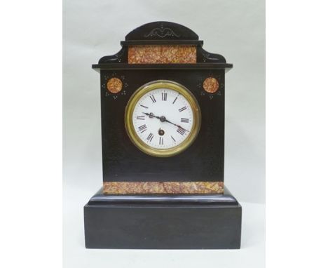 A LATE VICTORIAN BLACK SLATE MANTEL CLOCK with Rosso Antico panels, enamel dial with Roman numerals, 36cm high 