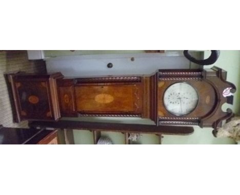 UN-NAMED A Victorian inlaid mahogany longcase clock, having hood with swan neck pediment over four candy twist pilasters, tri