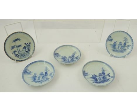 FOUR MID 18TH CENTURY QING DYNASTY PORCELAIN SAUCERS, hand painted with cobalt blue pagoda decoration, bears "Christies" Nank
