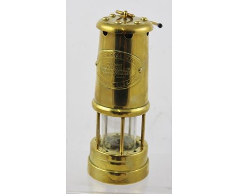 A WELSH BRASS MINING LAMP with suspension hook, 22cm high 