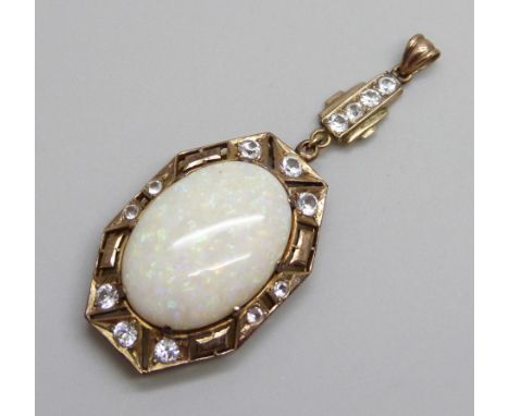 An Art Deco yellow metal drop pendant set with white stones and a large opal, opal 16mm x 24mm, 8g