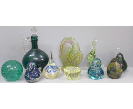 A collection of glass paperweights including two Mdina birds, green glass flask and a Swaziland glass giraffe
