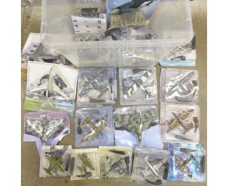 A large box of assorted model aircraft in sealed packets 