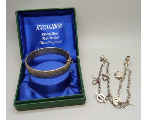 A vintage silver bangle in original box and two silver charm bracelets, 51g