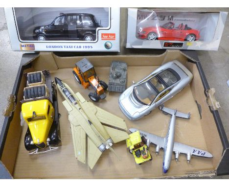 A Sunstar London taxi cab 1998, a UT model BMW and a collection of other toys including aircrafts, tractor, etc.
