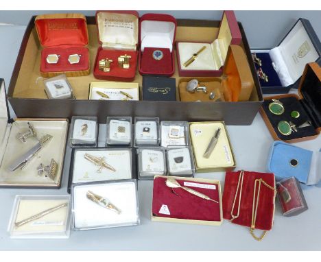 A collection of tie pins, cufflinks and sets