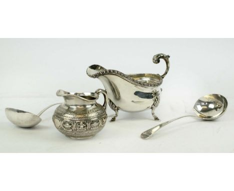 SAUCE BOAT, Georgian style, silver helmet shaped, Birmingham 1929, acanthus cast handle, three hoof feet; a silver milk jug w