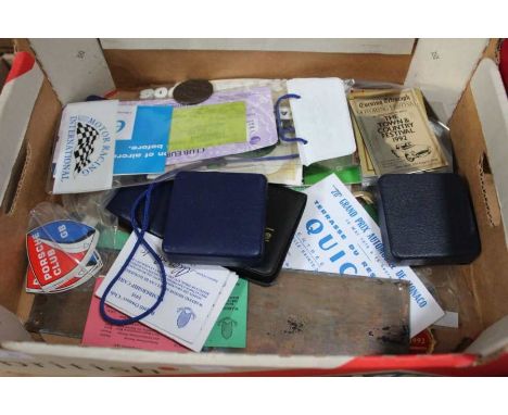 A box containing a wide selection of motoring ephemera&nbsp; to include, club badges, commemorative medallions, Grand Prix ad