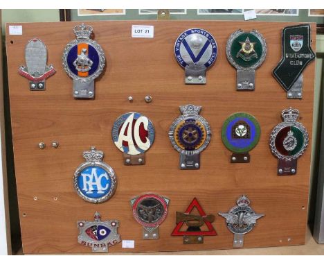 A presentation board of mounted metal motor club badges, Bugatti Owners amongst various others