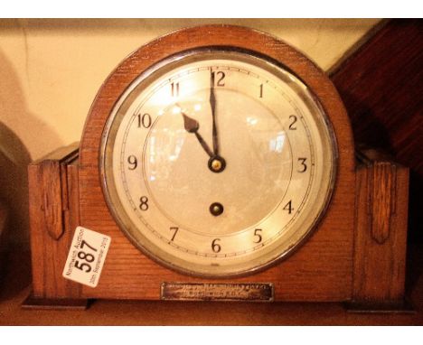 Oak cased Art Deco style mechanical mantel clock and presentation plaque from Northwich RDC 1952