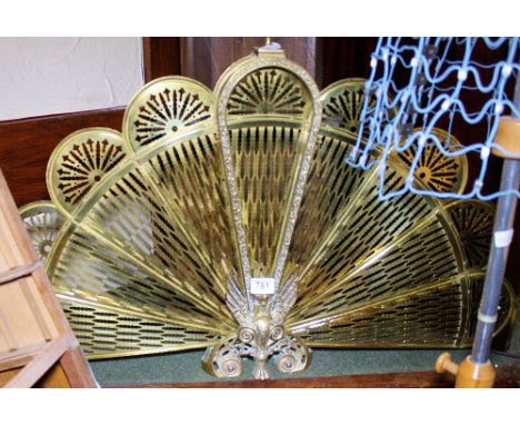 Large brass peacock fire screen with fold out fan