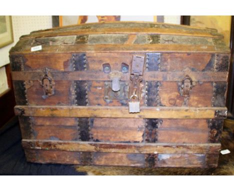 Antique dome topped wood travelling trunk with metal fittings