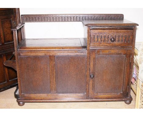 Oak hall seat with carved decoration, underseat storage, drawer, cupboard and stick stand, W ~ 93cm