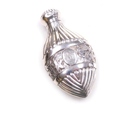 A Victorian silver scent bottle, of fluted flask form, with an embossed and engraved central band of leaves, oval reserve, mo