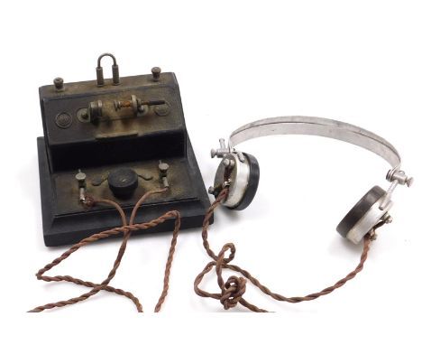 An early 20thC vintage BBC crystal radio set, with a pair of SG Brown of London type F2000 speaker headphones.