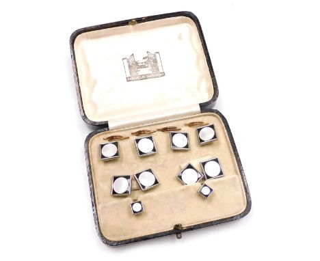 An Art Deco gentleman's formal dress jewellery set, in mother of pearl and black enamel, comprising a pair of cuff links, fou