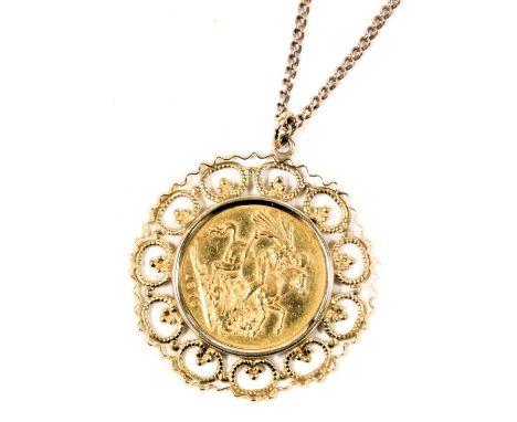 A Queen Victoria young head gold sovereign 1879, in a circular filigree round mount, yellow metal, on a 9ct gold curb link ne