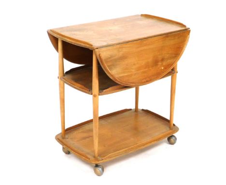 An Ercol light elm trolley, with a galleried drop front top, above two further tiers, united by turned legs, on castors, 75cm