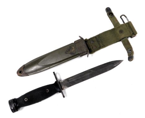 A US M8 bayonet, in a US M8 A1 scabbard.