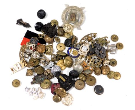 Military cap badges, including the RAF and Nova Scotia Highlanders, military and livery buttons, and a Leicester County Speci
