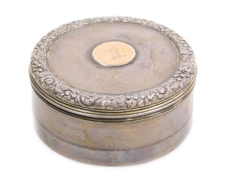 A George IV silver cylindrical box and cover, with engine turned decoration, the lid with a border embossed with roses, shamr