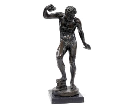 After The Antique.  A 19thC Grand Tour plaster figure of a dancing faun, with cymbals, raised on a circular base, 58cm high. 