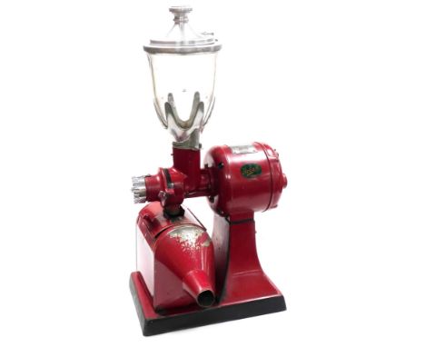 A vintage mid century Hobart coffee grinder, with a red metal casing, model no. E2120, 78cm high.
