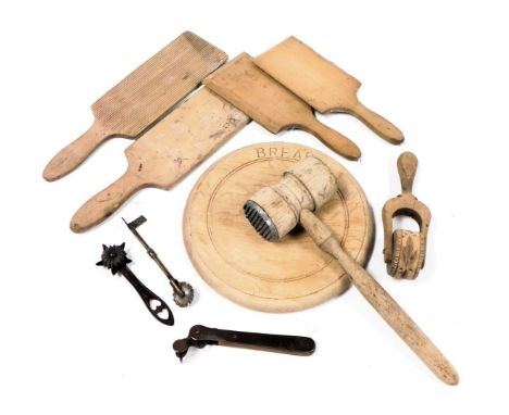 Vintage kitchenalia, including a meat tenderiser, pastry roller, butter pats, tin opener and a pastry cutter.