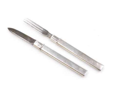 An early 20thC silver cased campaign knife and fork, hallmarks worn, James Fenton, Birmingham assay, 12.5cm wide open.