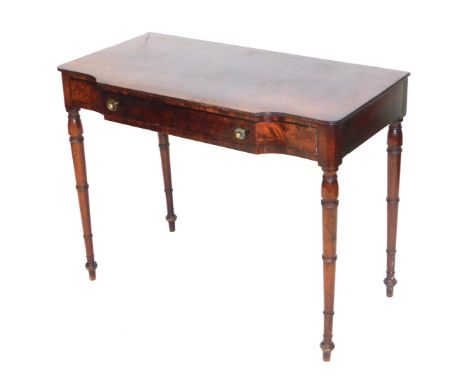 An early 19thC Continental flamed mahogany side table, with long shaped frieze drawer, raised on ring turned legs, 76cm high,
