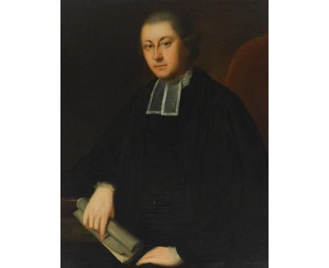 19thC English School.  Half length portrait of a clergyman, holding a paper scroll, oil on canvas, 90cm x 70cm.