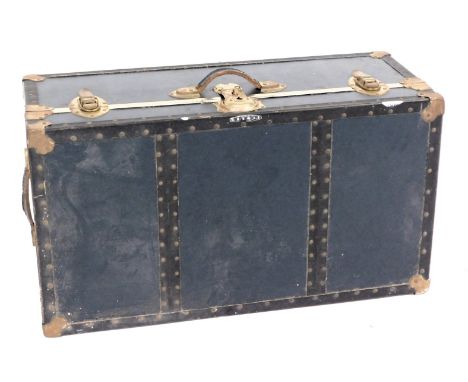 An early 20thC vintage canvas and metal bound Seaward trunk, with leather carrying handle, 32cm high, 78cm wide, 43cm deep.