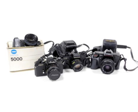 Two Minolta 5000 cameras, one boxed, Minolta XD7 camera, and a  Mamiya ZE camera. (4)