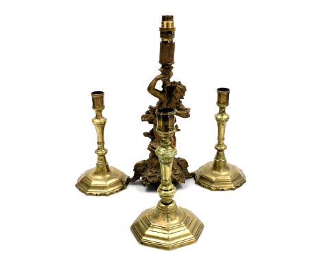 A 19thC gilt spelter table lamp, modelled as a merman, raised on a rococo base, 37cm high, a pair of Georgian brass candlesti