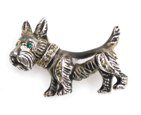 A 1950s Bohemian Jewellers Limited Scottie dog brooch, set with marcasites and emerald green and glass eyes, the body of whit