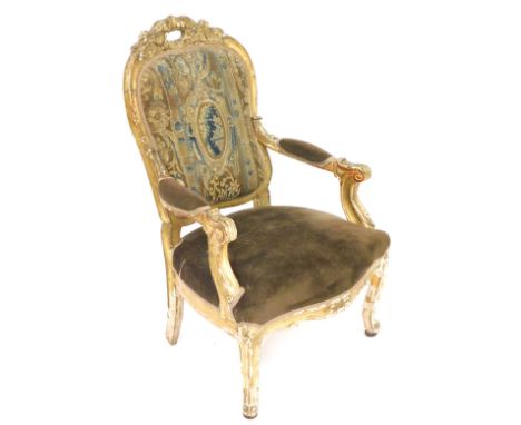 An 18thC Louis XV/XVI gilt wood and gesso fauteuil, with overstuffed tapestry back, the arms and seats overstuffed in brown d