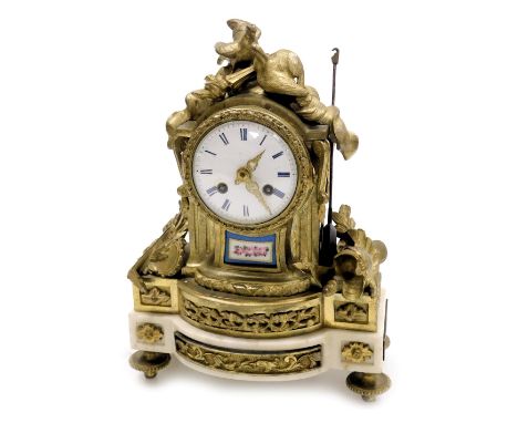 A late 19thC French brass marble and porcelain mantel clock, circular enamel dial bearing Roman numerals, eight day movement 