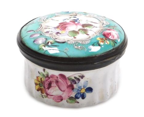 A late 18thC Bilston enamel patch box, of circular form, decorated to the lid in bas-relief with flowers, on a white and turq