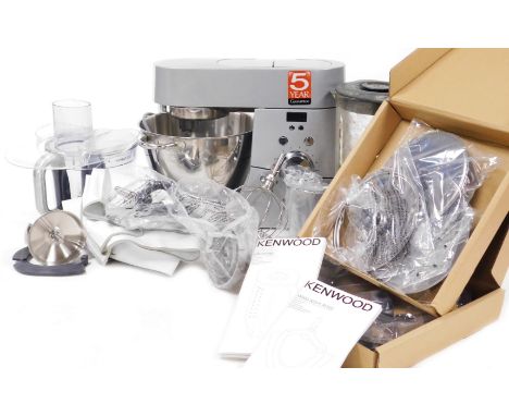 A Kenwood Chef Titanium Mixer, together with blender, slicer, attachments, instructions and cover.