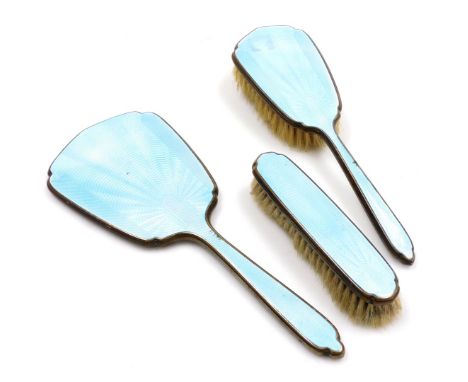 An early 20thC silver plate and turquoise blue guilloche enamel toilet set, comprising clothes and hair brushes, and a hand m